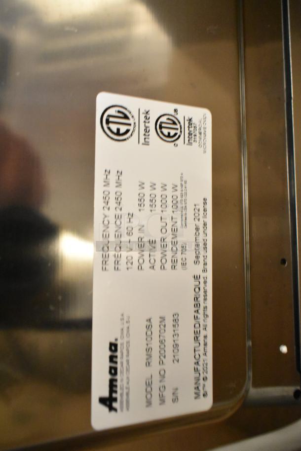 Brand new 2021 Amana RMS10DSA stainless steel commercial microwave with dial controls, ETL certified label visible.
