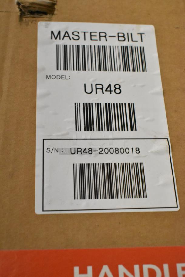 Brand new Master Bilt UR48 stainless steel 2-door undercounter cooler packaging with model and serial number labels visible.