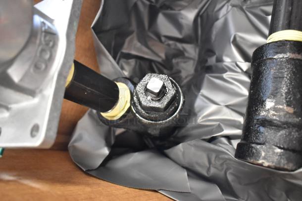 New Antunes MS-355CF shutoff valve in box, close-up view. Box contains four units. Rugged metal construction, yellow seal.