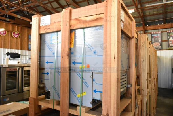 Brand new 2022 BKI 52473-1 stainless steel meat freezer in crate, on casters, 115V, single phase; packaging labels visible.
