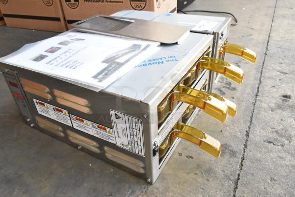 Brand new Henny Penny MPC-1L stainless steel holding bin. Features: modular design, 120V, 1 phase, gold handles.