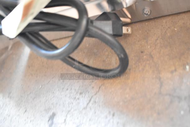 Coiled black power cord for a Henny Penny MPC-1L stainless steel commercial holding bin, 120 volts, 1 phase, new condition.