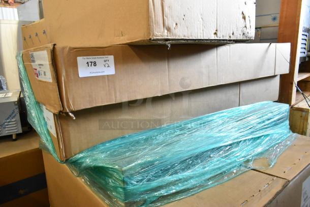 2 brand new boxes of 4 Metro 2448NK3 green epoxy-coated wire shelves, 48"W x 24"D, with auction details visible.