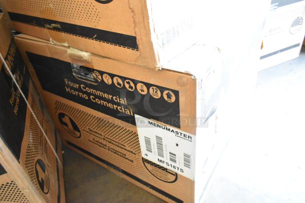 New Menumaster MFS18TS stainless steel commercial microwave oven in box, 2022 model, sealed packaging visible.