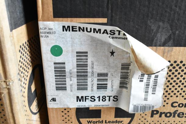 New Menumaster MFS18TS commercial microwave oven in box. Label shows model and serial number, assembled in USA.