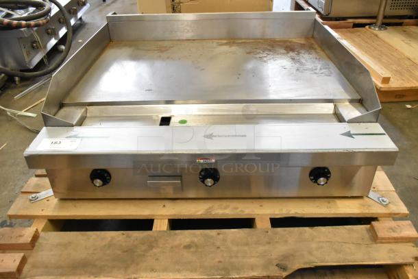 BRAND NEW Southbend PE36N-TTT stainless steel electric griddle, 208V, 1 phase, in box, with control knobs on front.