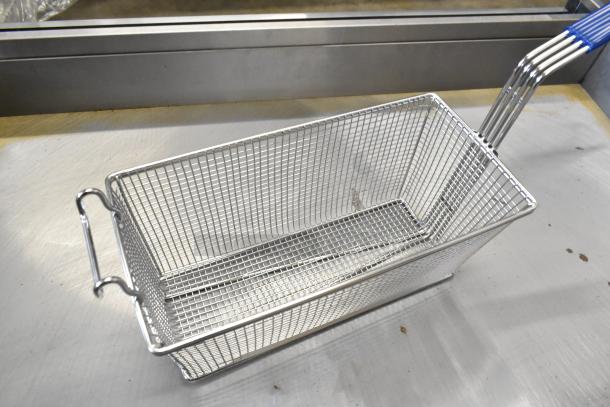 Brand new metal fry basket with blue handle, featuring a wire mesh design for optimal frying. Box included.