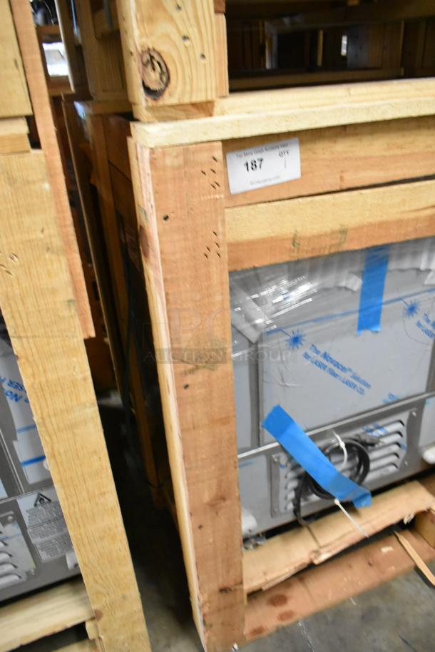 Brand new BKI 52473-1 stainless steel meat freezer in crate, on commercial casters. Visible tag: “187 QTY.” 115V, 1 Phase.