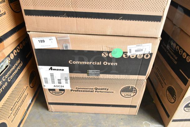 New Amana AOC24 Stainless Steel Commercial Microwave in box. Features touch pad, 208-240 volts. Model: AOC24.