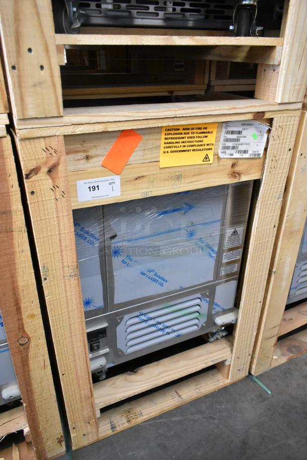 BRAND NEW 2022 BKI 52473-1 stainless steel commercial meat freezer in crate, on casters, 115V, 1 Phase, safety labels visible.