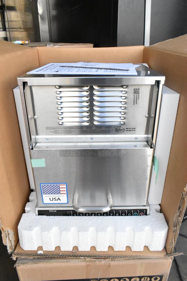 Brand new Amana AOC24 stainless steel commercial microwave with touch pad, 208-240 volts, in original packaging.