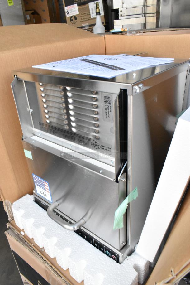 Brand new Amana AOC24 stainless steel commercial microwave with touch pad, 208-240 volts, in original packaging.