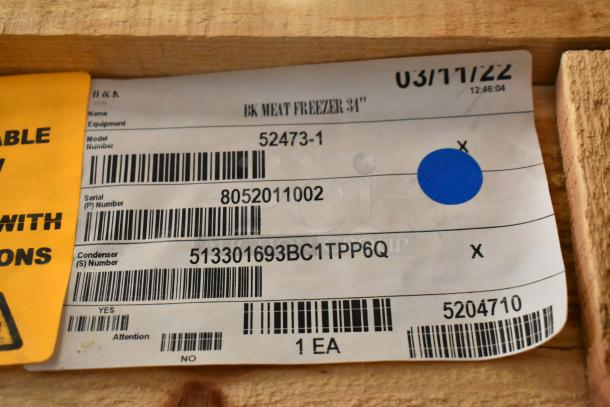 Brand new BKI 52473-1 stainless steel commercial meat freezer tag, showing model and serial numbers in crate.