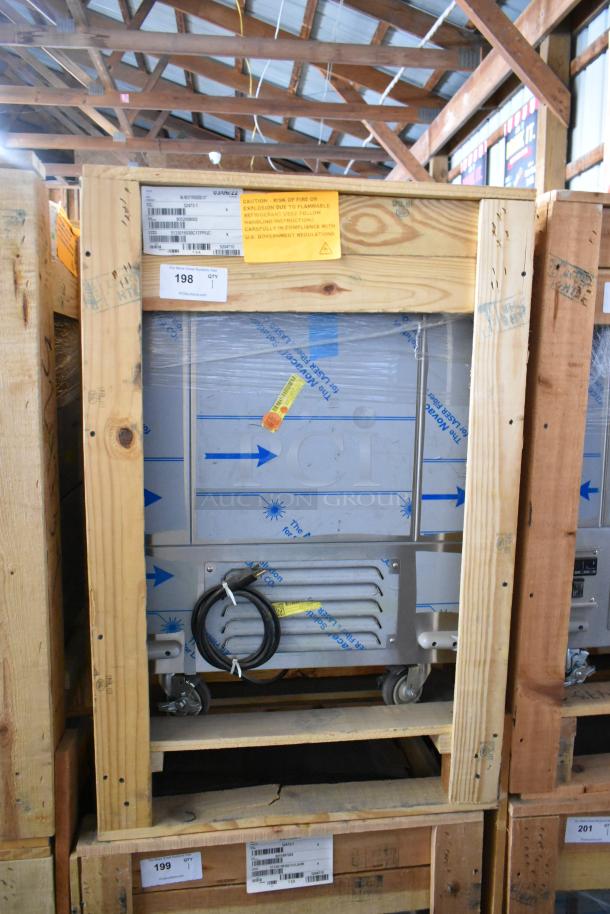 Brand new BKI 52473-1 stainless steel commercial meat freezer in crate, 115 volts, on commercial casters, model label visible.