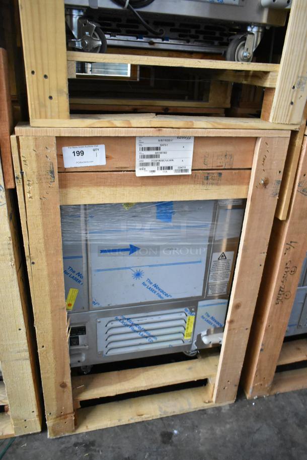 Brand new BKI 52473-1 stainless steel commercial meat freezer in crate. Features casters, 115V, 1-phase. Model details visible on labels.