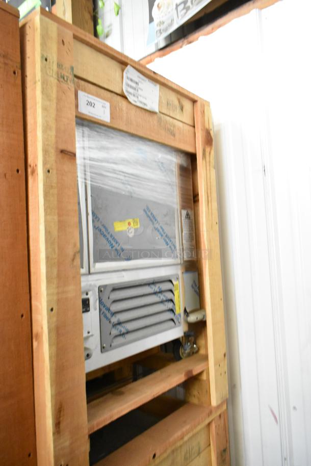 Brand new 2022 BKI 52473-1 stainless steel commercial meat freezer in crate, on casters, 115V, 1 phase.