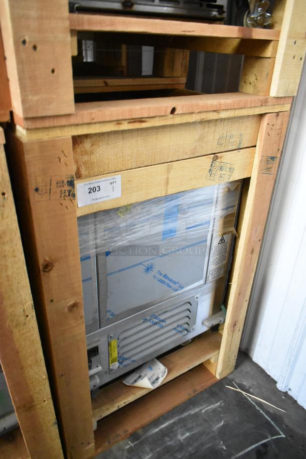 Brand new BKI 52473-1 stainless steel commercial meat freezer in crate on casters, 115V, 1 phase.