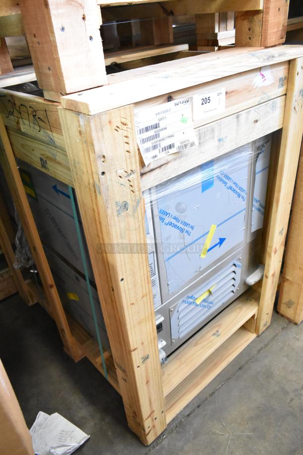 Brand new BKI 52473-1 stainless steel commercial meat freezer in crate, 115 volts, 1 phase, on commercial casters.