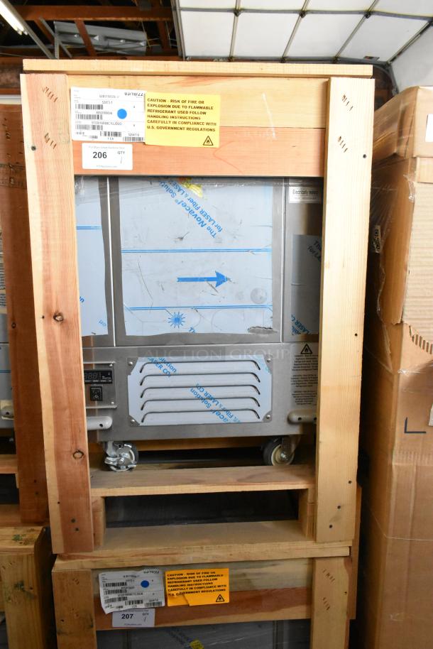 BRAND NEW in crate BKI 52473-1 stainless steel commercial meat freezer on casters, 115 volts, 1 phase, labels visible.