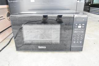 Brand new 2024 Galaxy 177MW900D0A microwave, office series, with push-button controls. Scratch and dent condition. 120V.