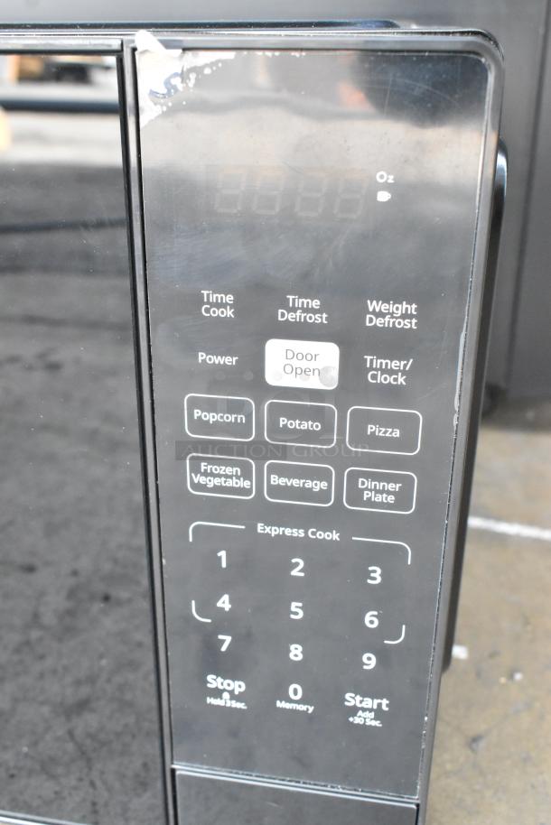 BRAND NEW Galaxy 177MW900D0A microwave, push button controls, minor scratch, 2024 model, 120V, 1 phase.