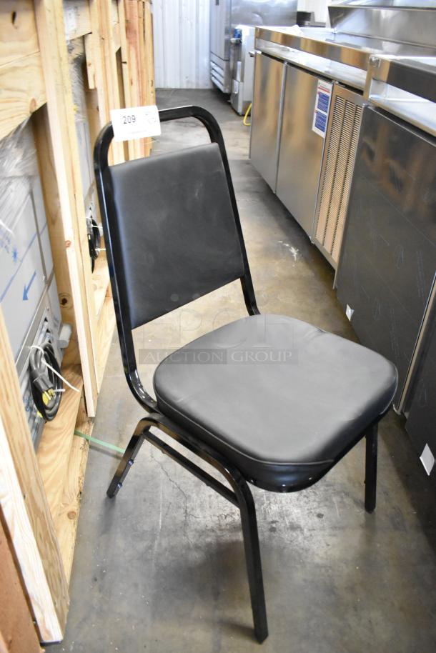Black metal stackable dining height chair, brand new, minimal scratches, cushioned seat and backrest, sturdy frame.