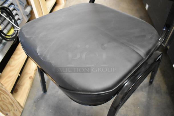 Black metal stackable dining height chair, brand new, with minor scratches and dents. Features padded seat. Quantity: 12.