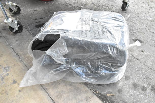 Brand new Xpose BMT-1250 mesh tarp, 12' x 50', black, heavy-duty, 6.5 oz, weatherproof, in original packaging with wear.