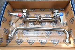 Brand new T&S B-0231-CR wall mounted pantry faucet with 8" centers, 12" swing nozzle, Cerama cartridges. Some scratches.
