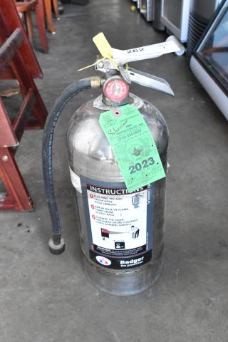 Badger WC-100 wet chemical fire extinguisher, silver, with hose and instructions, inspection tag dated 2023. Pickup only.