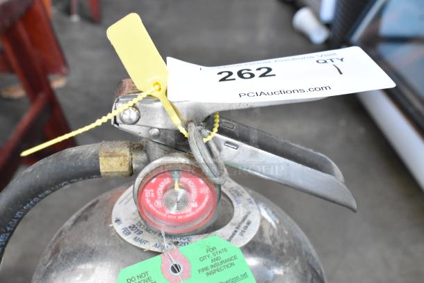 Badger WC-100 Wet Chemical Fire Extinguisher with attached inspection tags and pressure gauge, pickup only.