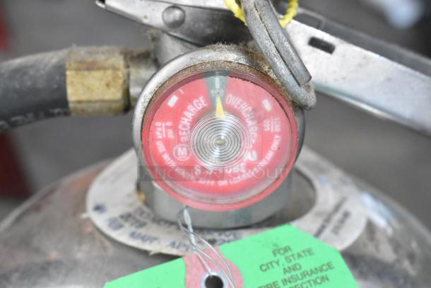 Badger WC-100 Wet Chemical Fire Extinguisher, features recharge gauge, green and white instruction tags, needs pickup.