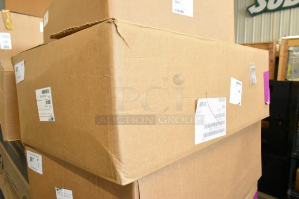 Cardboard box containing a Prince Castle 464-B stainless steel 13-inch toaster. Box labeled "scratch and dent." Front loader, single chamber.