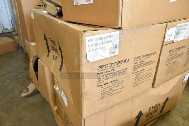 Cardboard boxes labeled "This Side Up" containing a brand new 2021 H&K EHB Holding Bin with visible dents and inspection instructions.