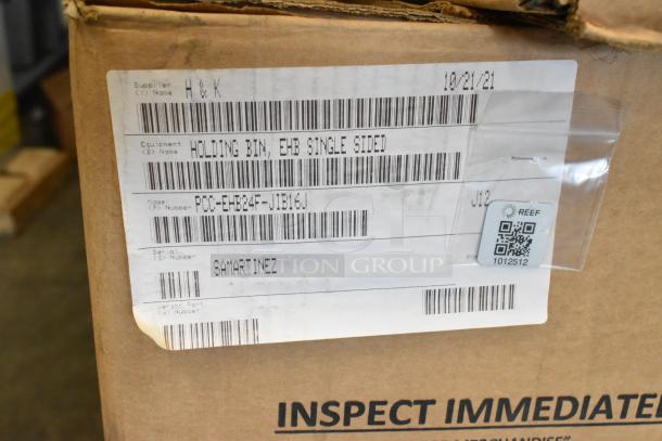 Brand new H&K EHB single-sided holding bin 2021 model, with visible labels and barcodes, showing scratch and dent condition.