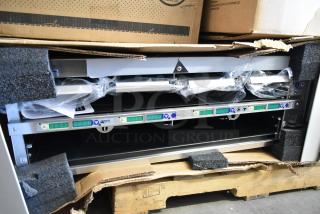 Brand new 2021 H&K EHB Holding Bin, visible scratch and dent, in packaging on a pallet, protective foam and wrap intact.