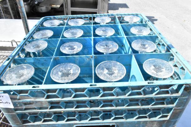 6 Poly dish caddies on a dolly, containing stemmed glassware; stackable design, in used condition, labeled for auction.
