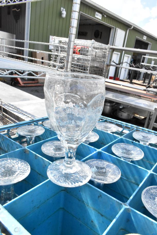6 poly dish caddies on dolly with stemmed glassware. Includes multiple glasses, ideal for restaurant use.