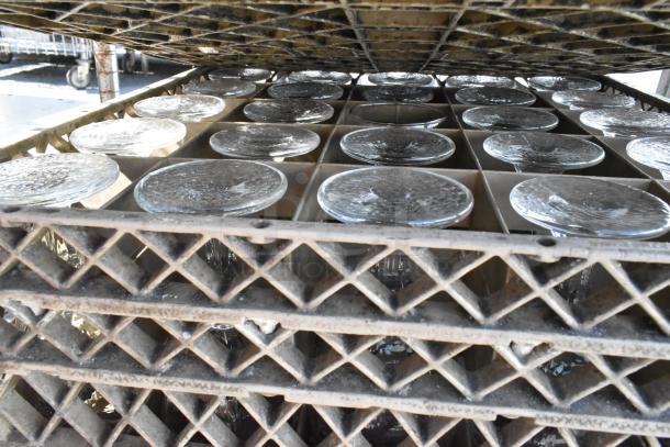 6 poly dish caddies on a dolly holding stemmed glassware, visible stacked layers. Sturdy design, ideal for bulk storage.
