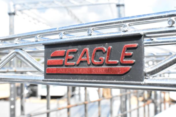 Chrome finish 5-tier Eagle wire shelving unit with liquor cage and contents, on commercial casters. Buyer must dismantle.