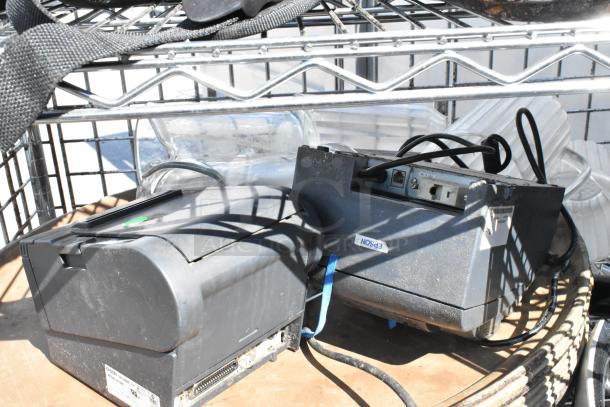 Chrome 5-tier wire shelving unit with liquor cage, contents, and Epson equipment. On commercial casters. Buyer must dismantle.