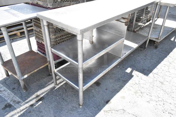 Stainless steel table with metal under shelf, durable and corrosion-resistant, ideal for industrial use.