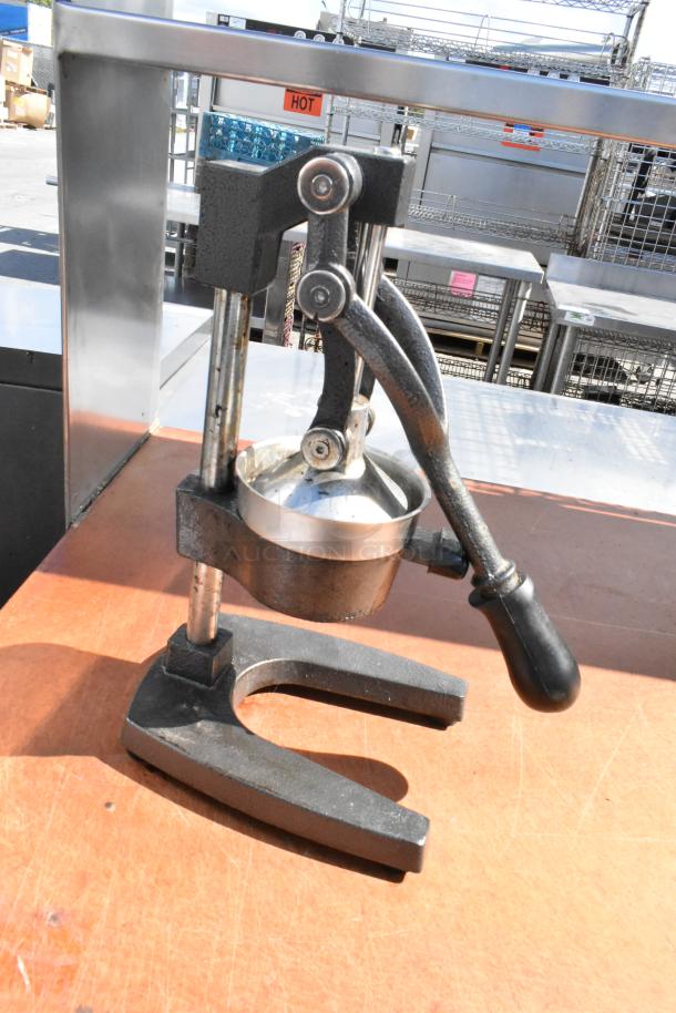 Stainless steel table with commercial can opener, 2-tier over shelf, under shelf, and stainless steel drop-in bins.