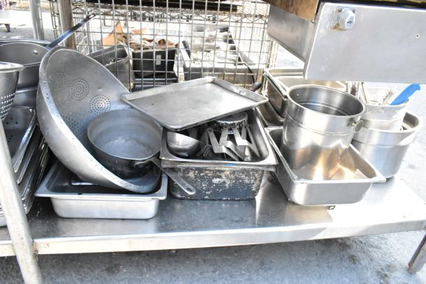 Stainless Steel Table with commercial can opener, 2-tier over shelf, under shelf, and stainless steel drop-in bins, used condition.