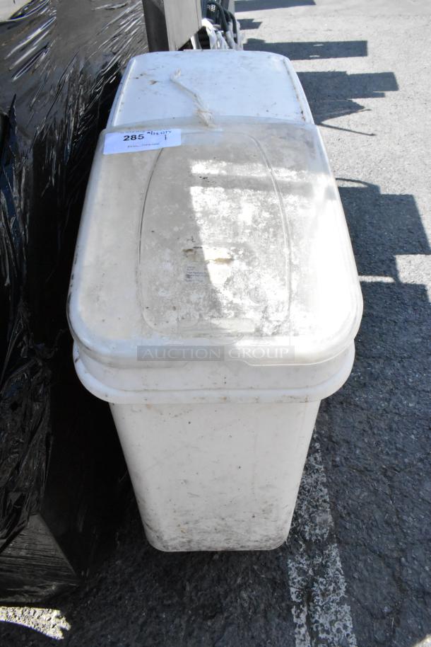 White poly ingredient bin on commercial casters, moderate wear, with label marked "285". Sturdy for kitchen use.