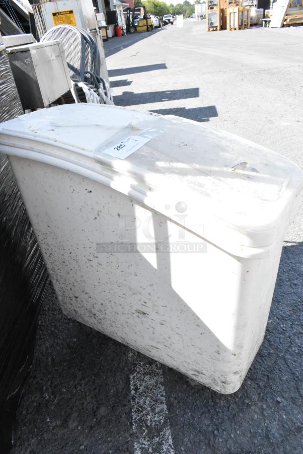 White poly ingredient bin on commercial casters, outdoor setting. Slightly soiled, label reads "285". Good for storage.
