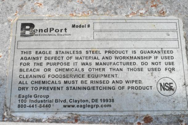 Close-up of label on stainless steel table by Eagle Group, cautioning against chemical use. Features BentPort logo, NSF mark.