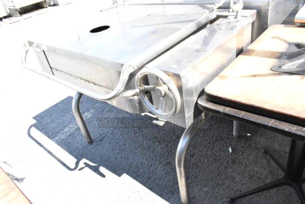 Stainless steel commercial manual tilt braising pan with hand crank, used condition, ideal for industrial kitchens.
