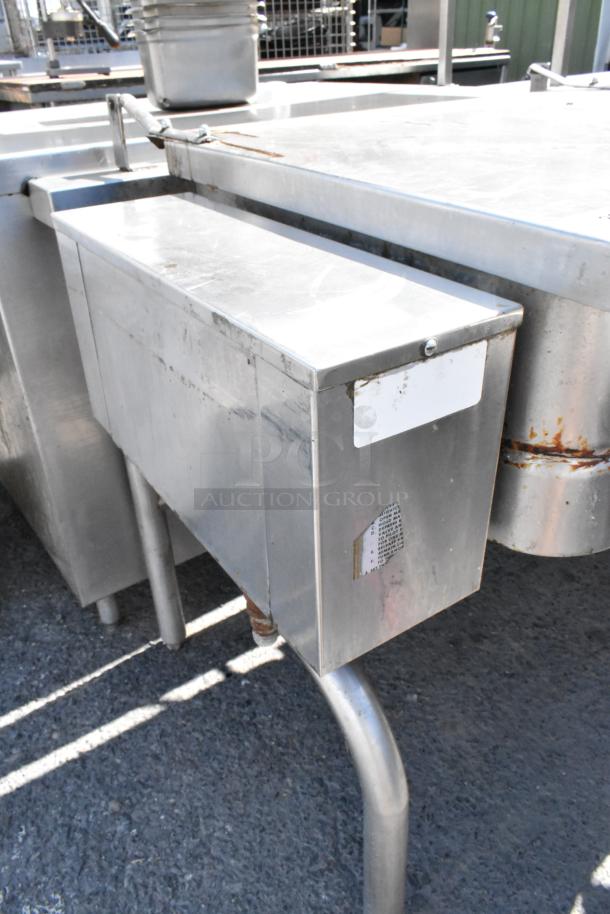 Stainless steel manual tilt braising pan, commercial grade, visible handle for tilting, slight wear, used condition.
