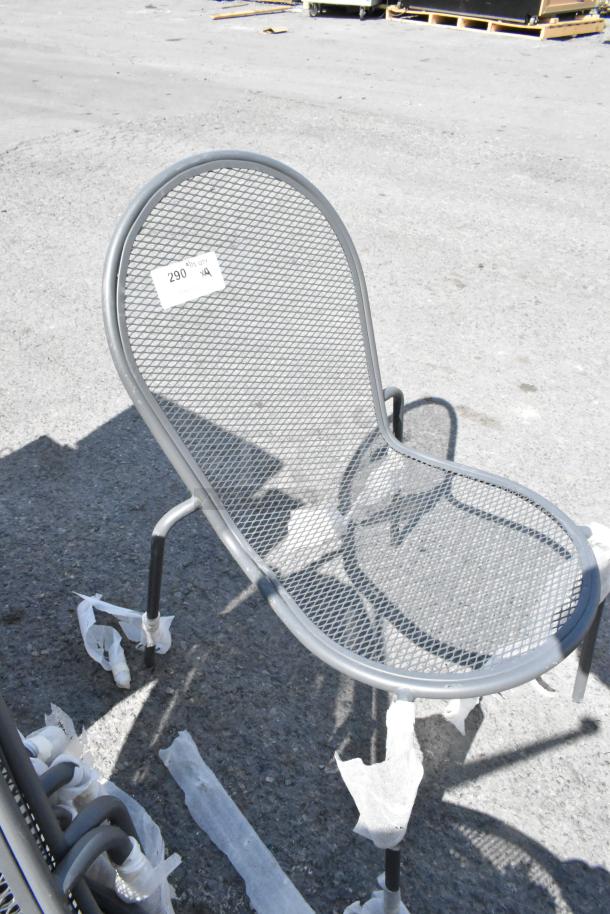 Black metal mesh patio chair, durable design, new condition. Label shows "290". Auction includes 9 chairs, amplifying bid value.